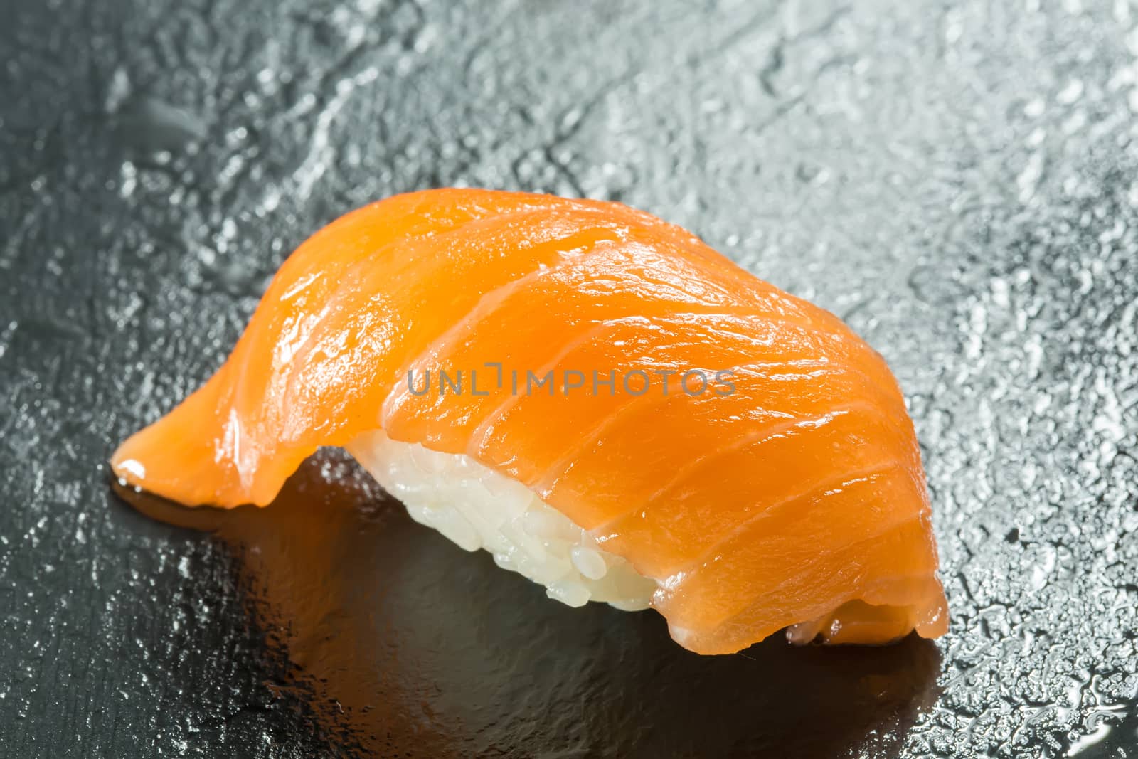sushi with organic salmon on black background