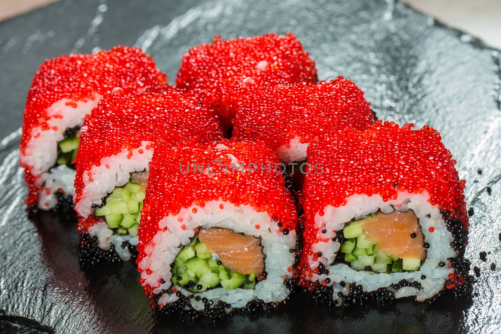 Japanese Cuisine - Sushi Roll with Tuna, Salmon, Conger and Flying Fish Roe