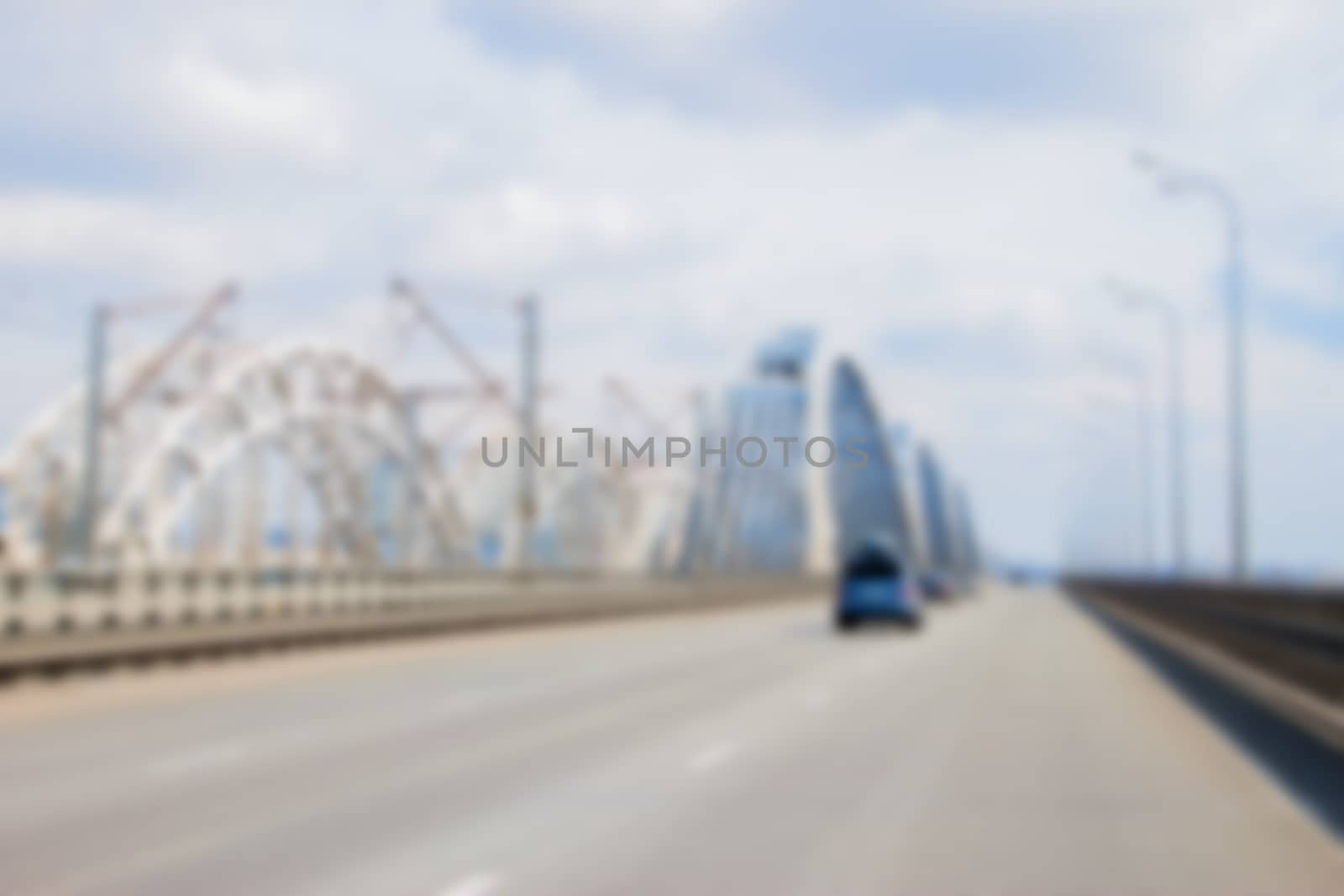 blurred car driving to the horizon on bridge