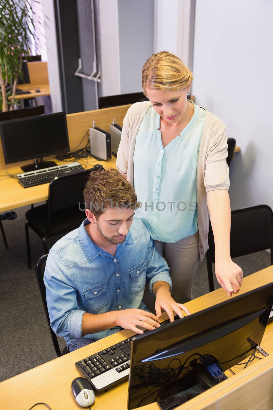 Students working on computer together at the university