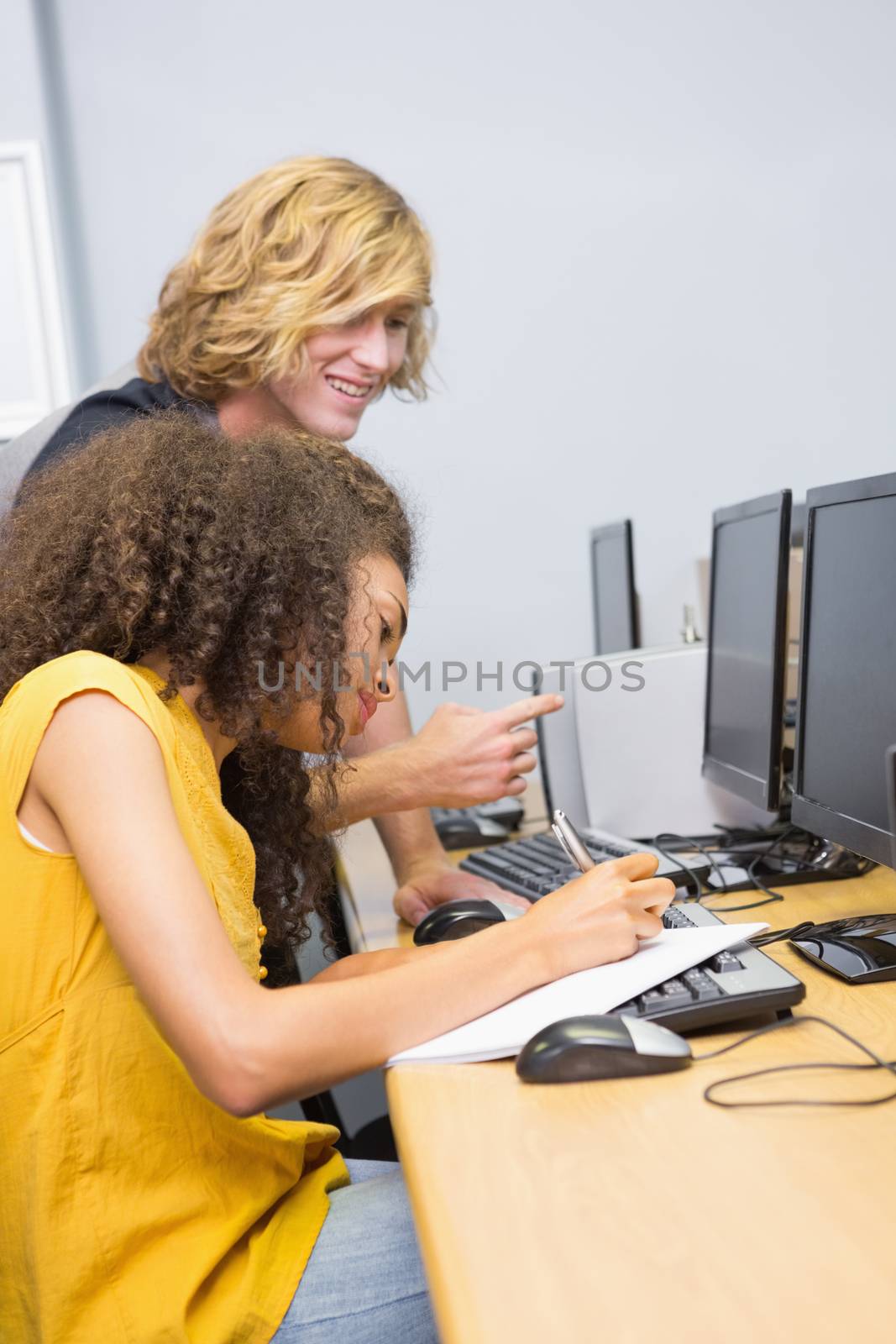 Students working on computer in classroom at the university