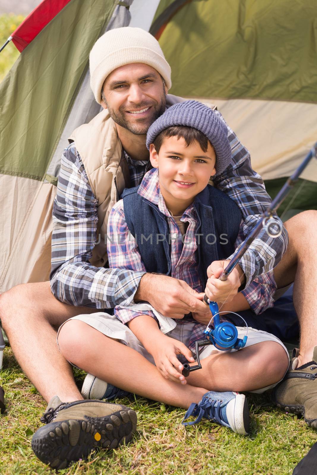 Father and son in their tent by Wavebreakmedia
