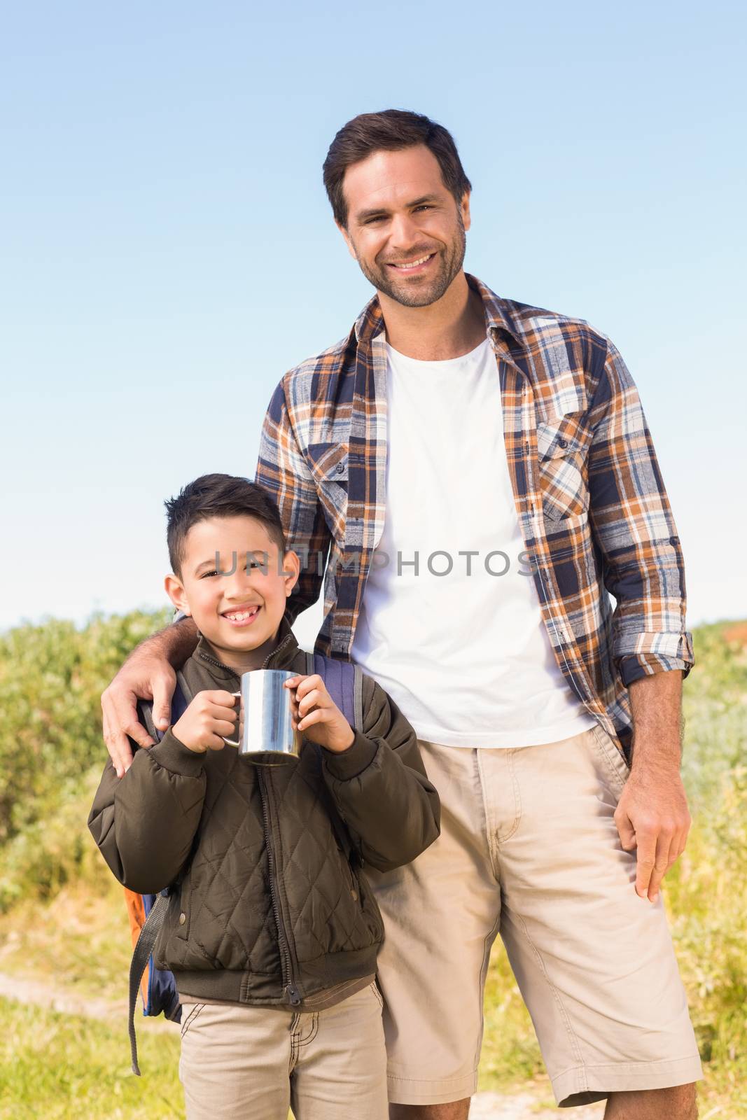 Father and son hiking in the mountains by Wavebreakmedia
