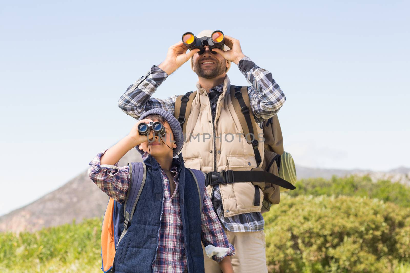 Father and son hiking in the mountains by Wavebreakmedia