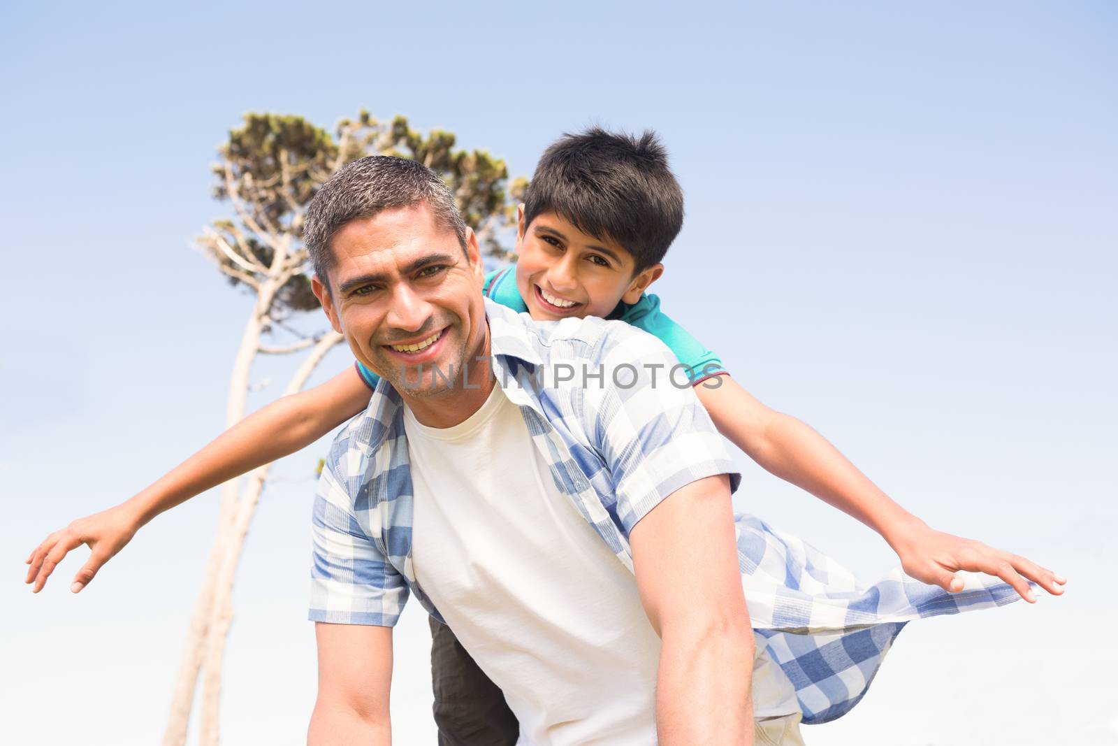 Father and son in the countryside on a sunny day