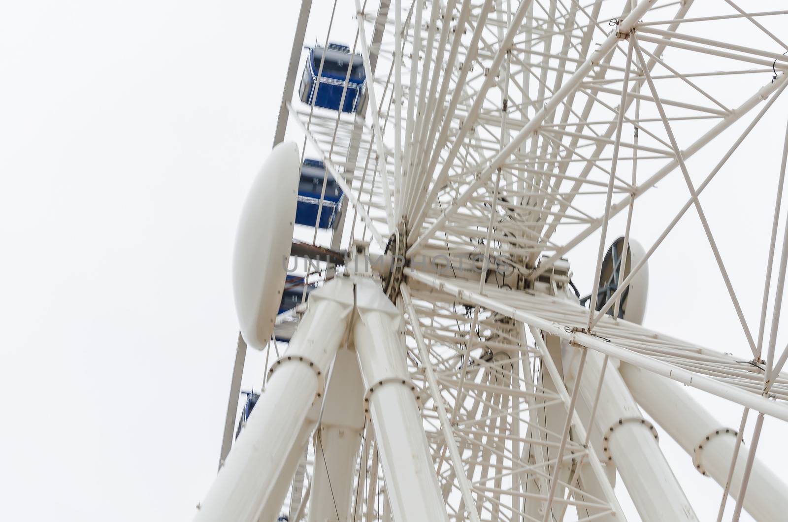View from below of the construction of a ferris wheel.