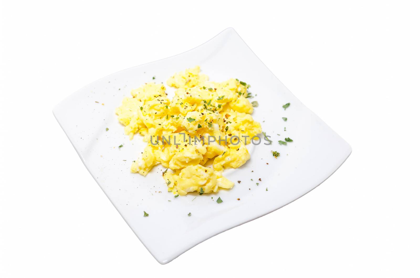 Breakfast with scrambled eggs. Plate of scrambled eggs on a plate against bright white background.