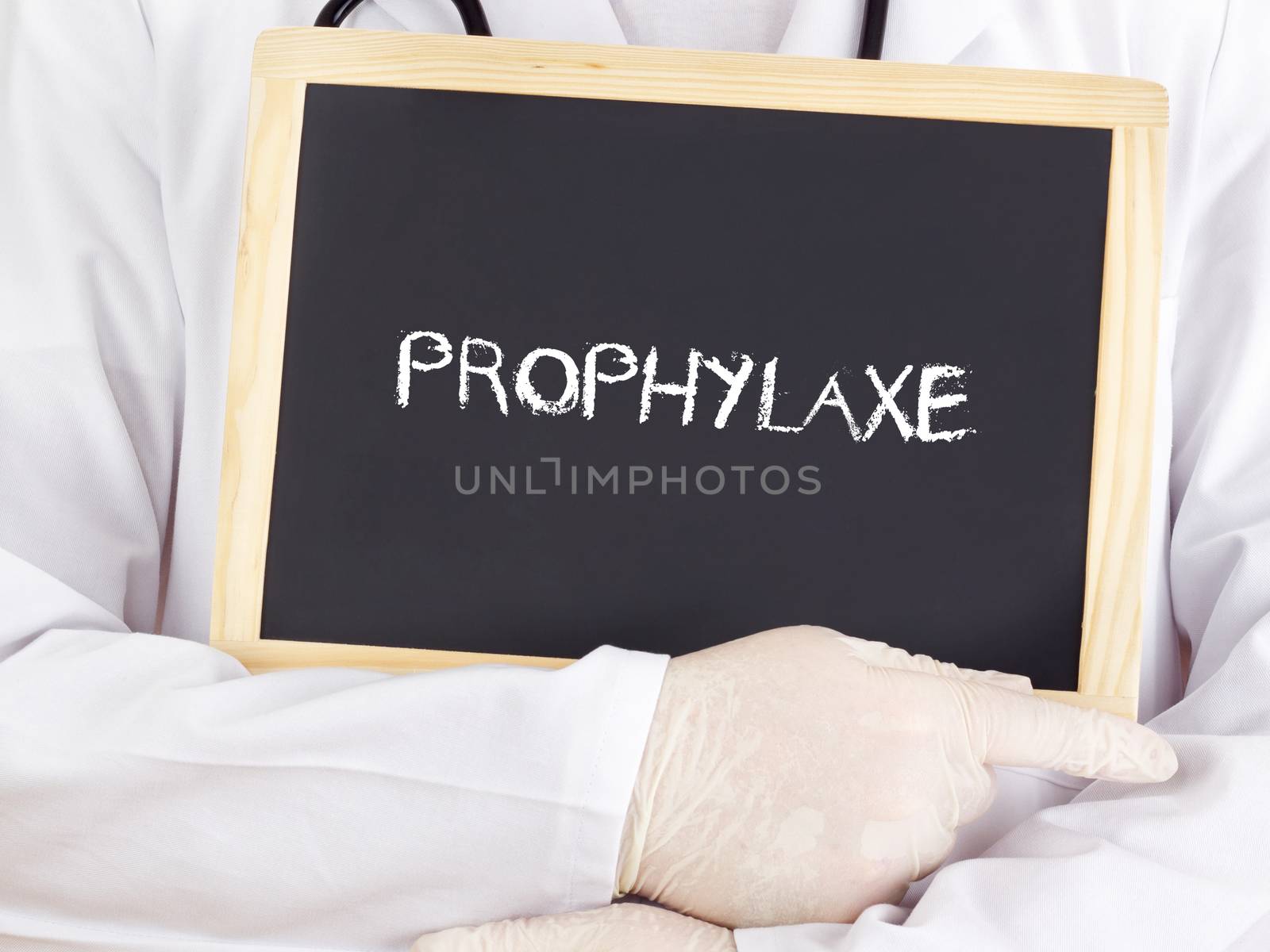 Doctor shows information on blackboard: prophylaxis in german
