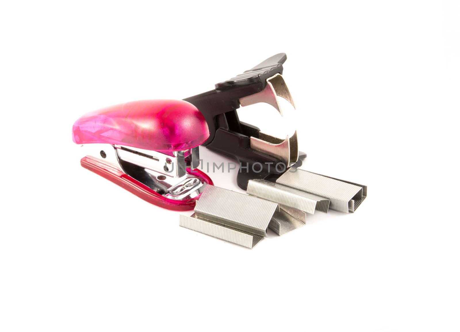stapler and staple remover isolated on white background with staples