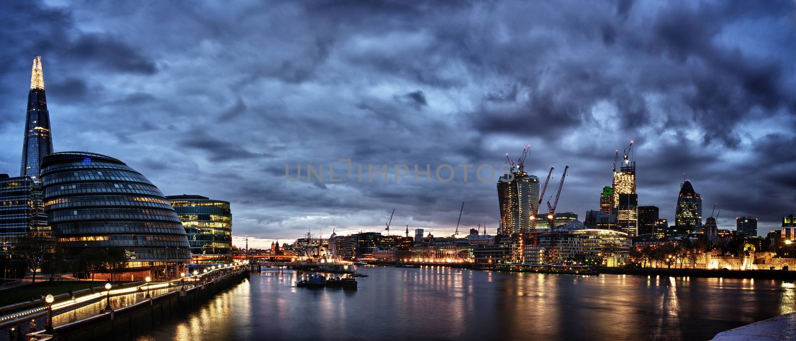 New London city hall at night , panoramic view from river.