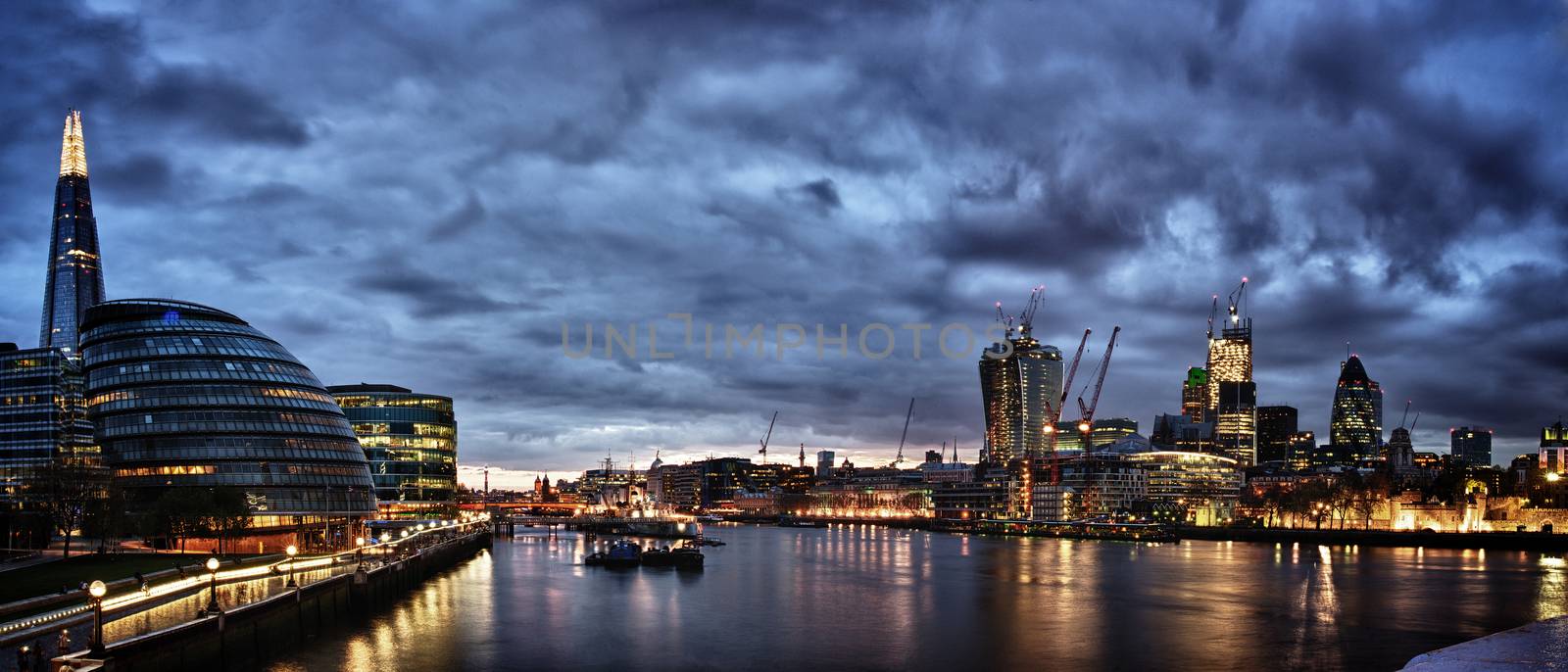 New London city hall at night , panoramic view from river.