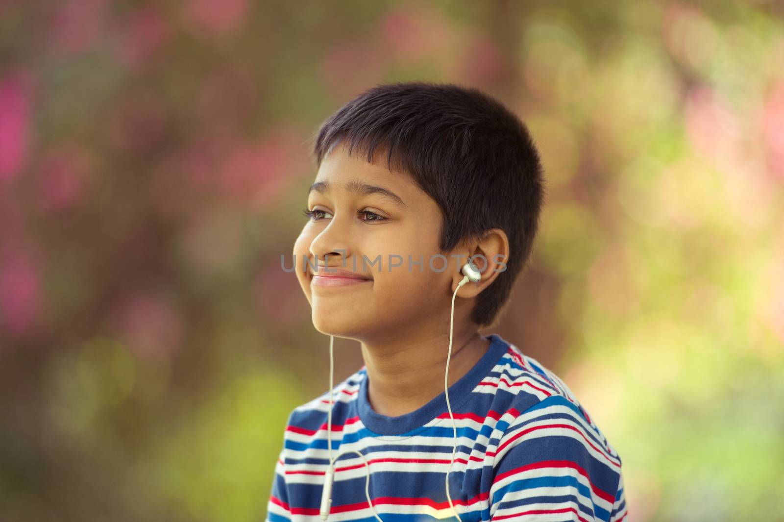 An handsome toddler having fun in the park