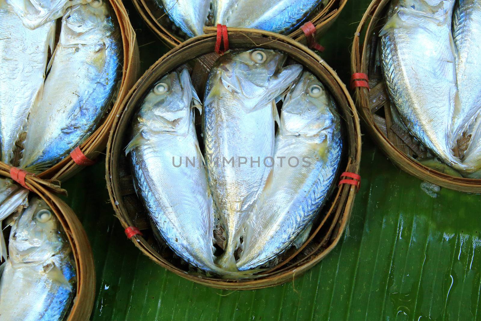 Mackerel fish in bamboo basket at market, Thailand by foto76