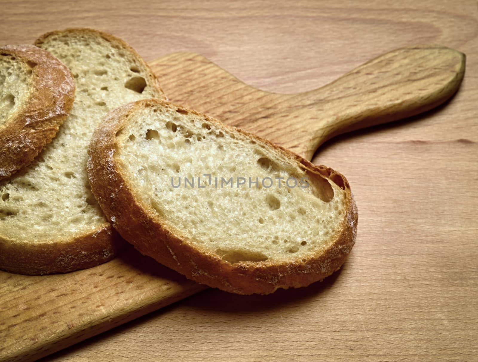still life with sliced bread on a cutting board