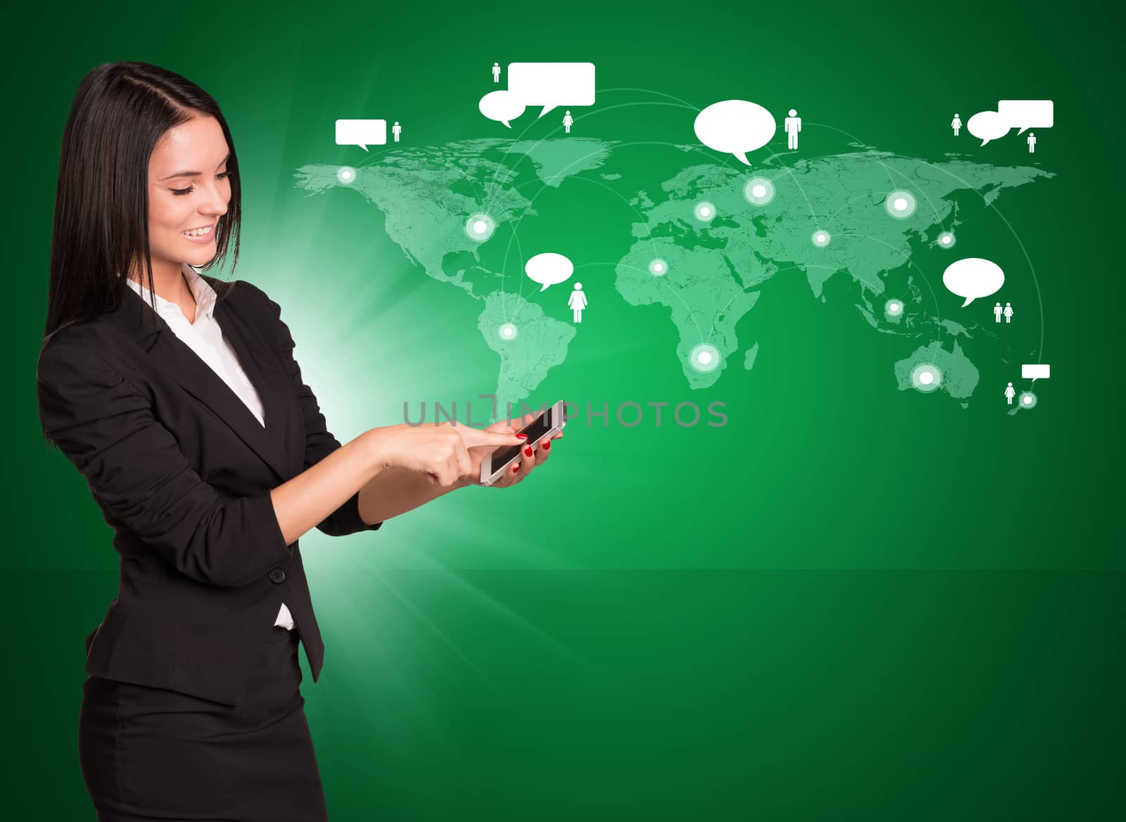 Smiling businesswoman in suit standing and using mobile phone  by cherezoff