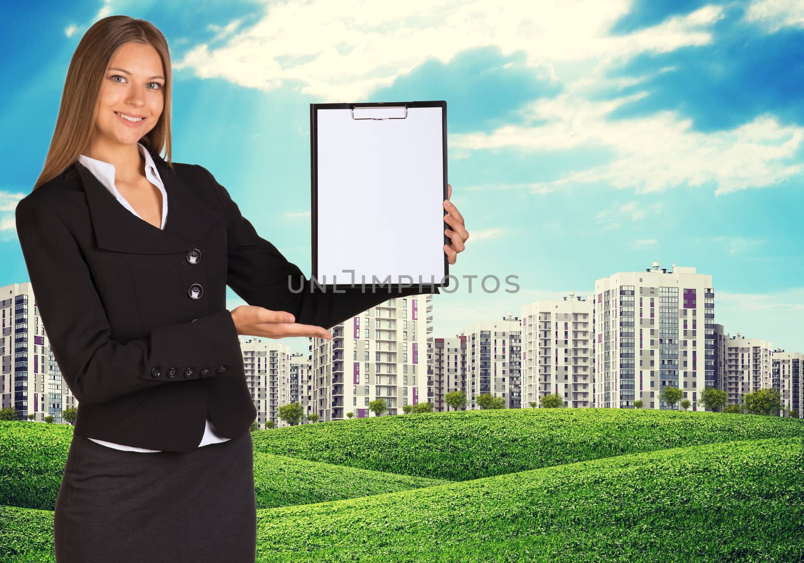 Young woman holding paper holder with nature and city on back by cherezoff