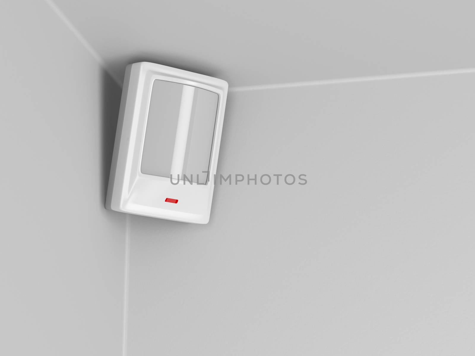 Burglar alarm motion sensor on grey wall