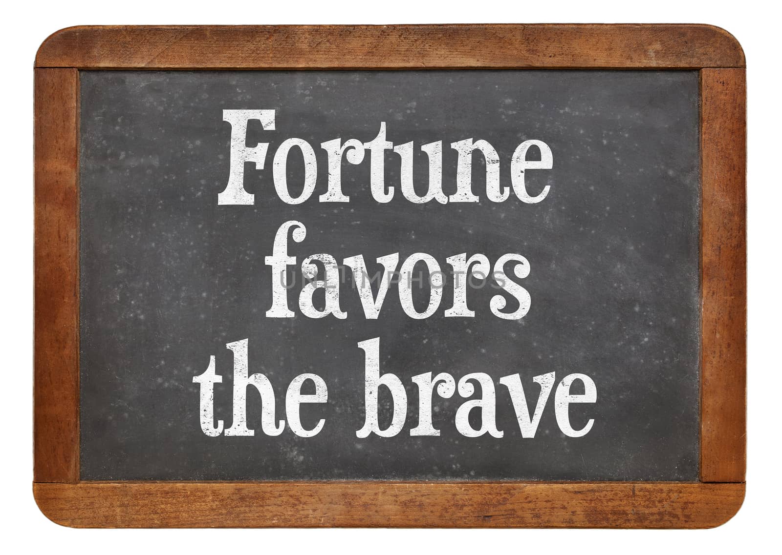 Fortune favors the brave - motivational words on a vintage slate blackboard