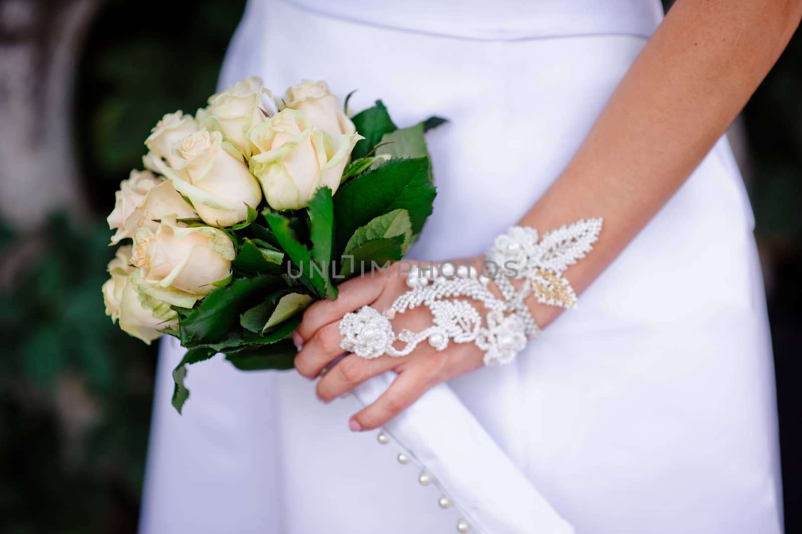 wedding bouquet at bride's hands by timonko