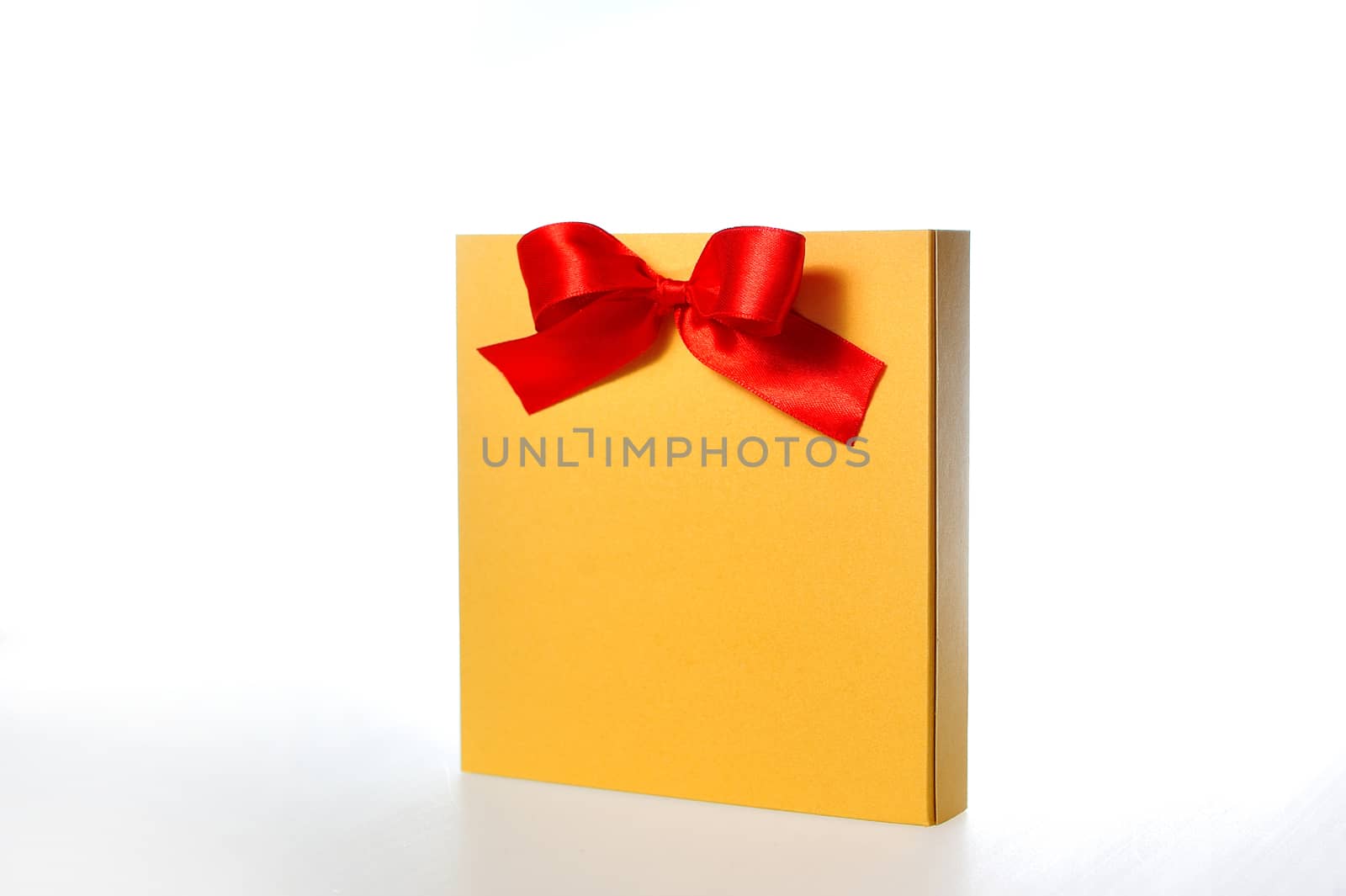 festive gold box with a red bow on a white background.