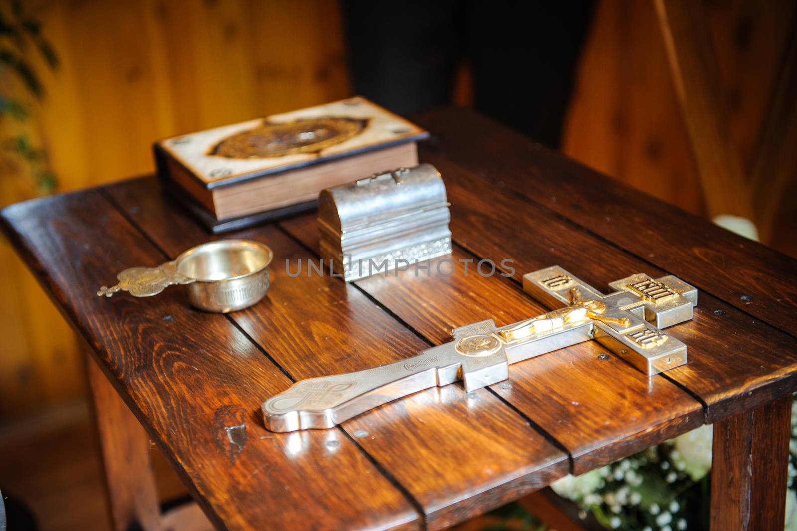 cross and bible on the wooden table.