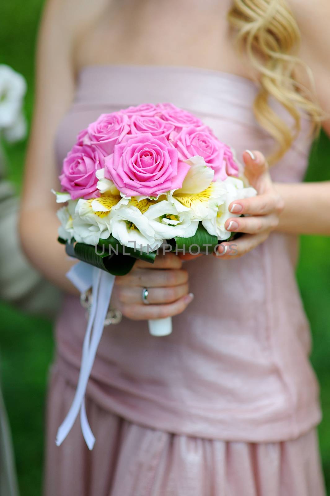bridesmaid holding a beautiful wedding bouquet