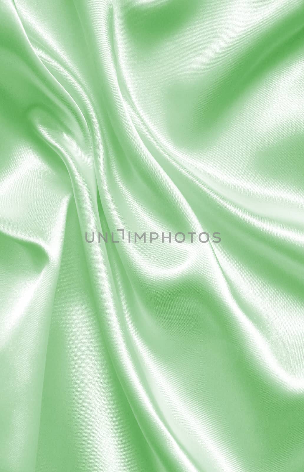Smooth elegant green silk or satin as background by oxanatravel
