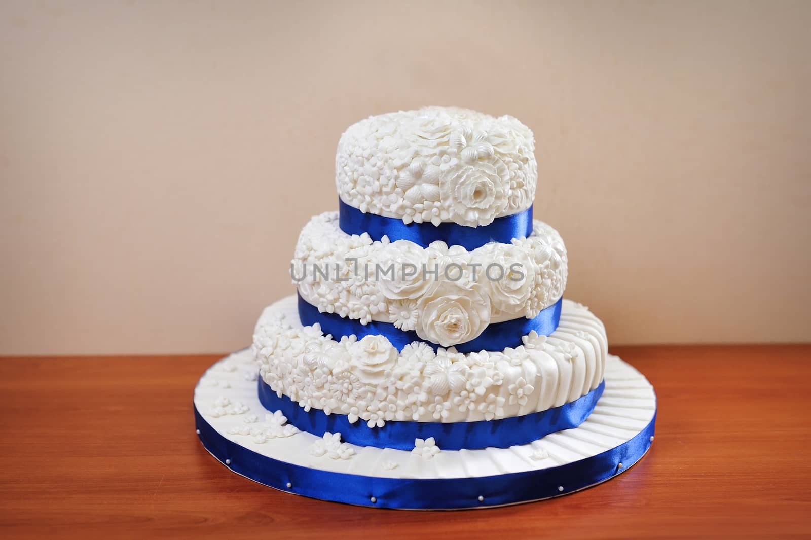 multi tiered wedding celebration cake with sugar flowers