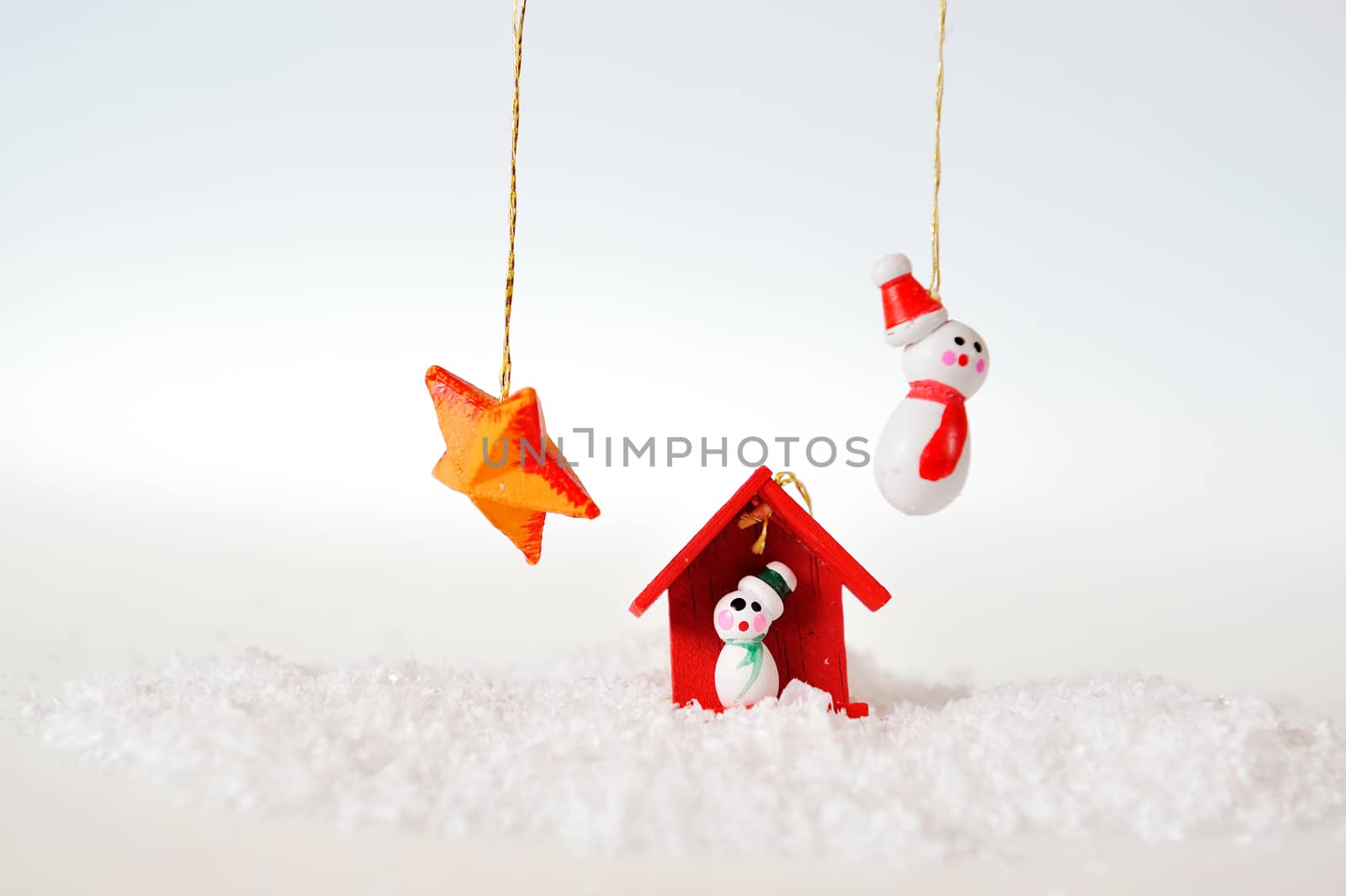 Snowman house and star on white background
