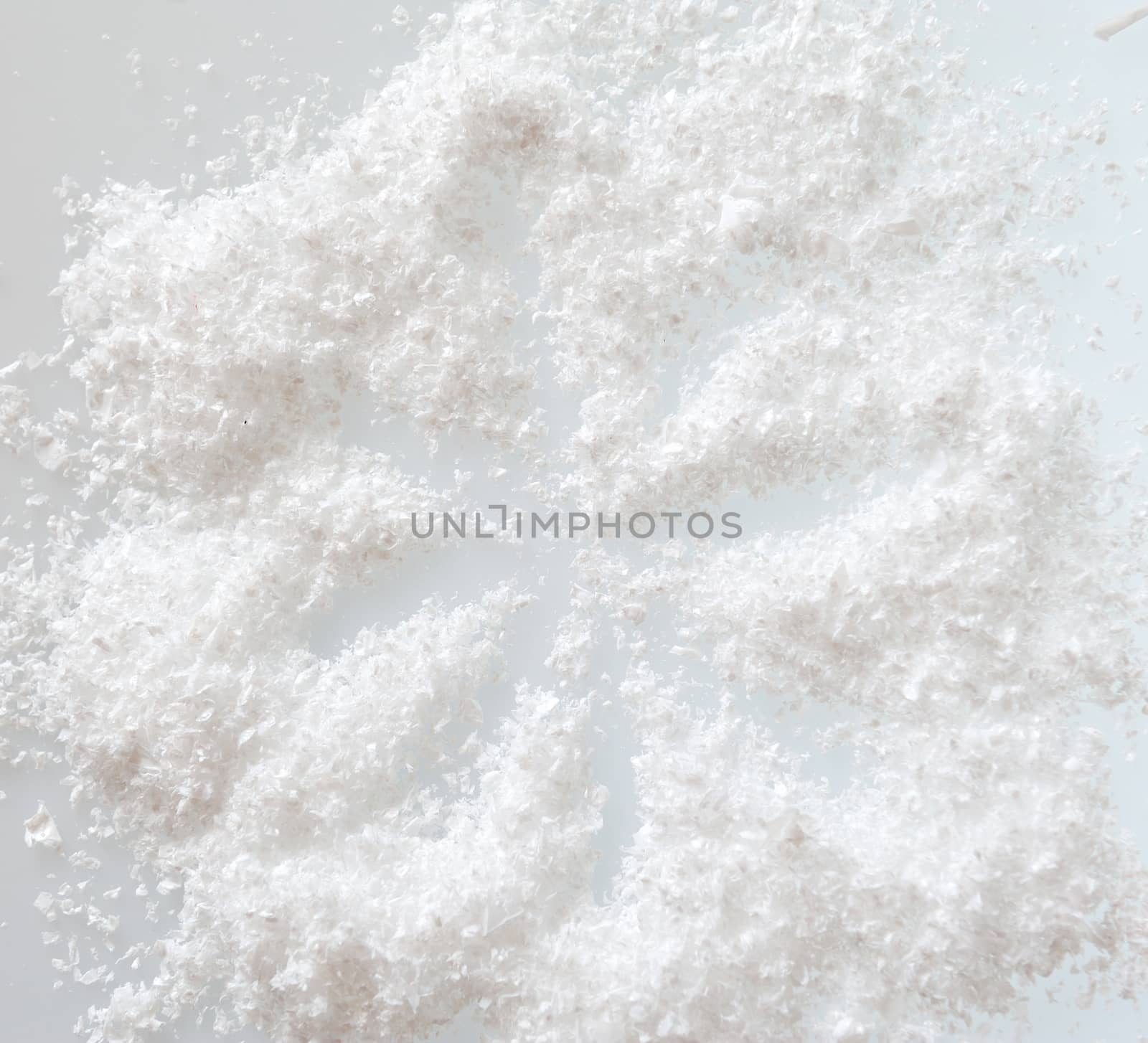 artificial snow on a white background. Abstract