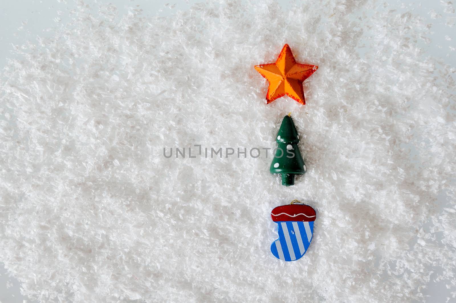 Christmas toys on white snow background