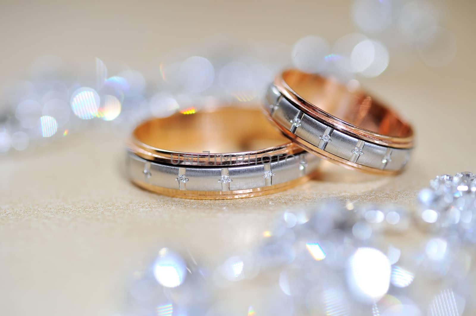 Gold wedding rings on table 