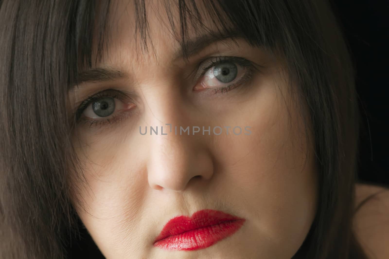 Photo of beautiful brunette with red lips