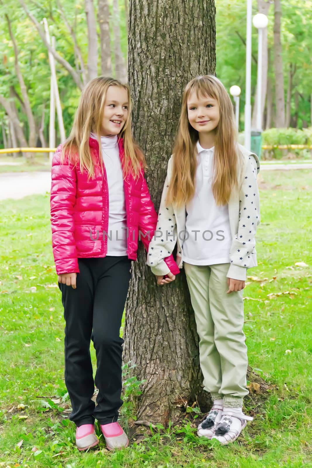 Photo of two cute girls with long hairs