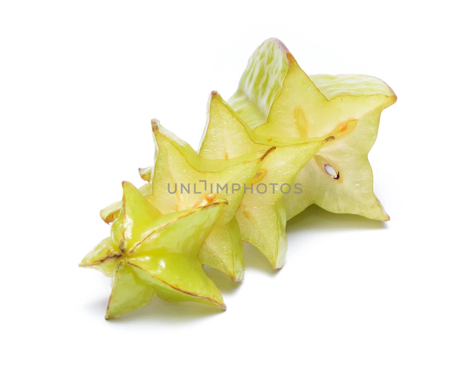 Unripped star fruit - carambola isolated on white background by comet