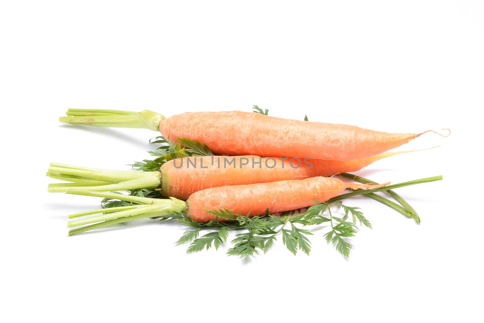 fresh carrots isolated on white background by comet