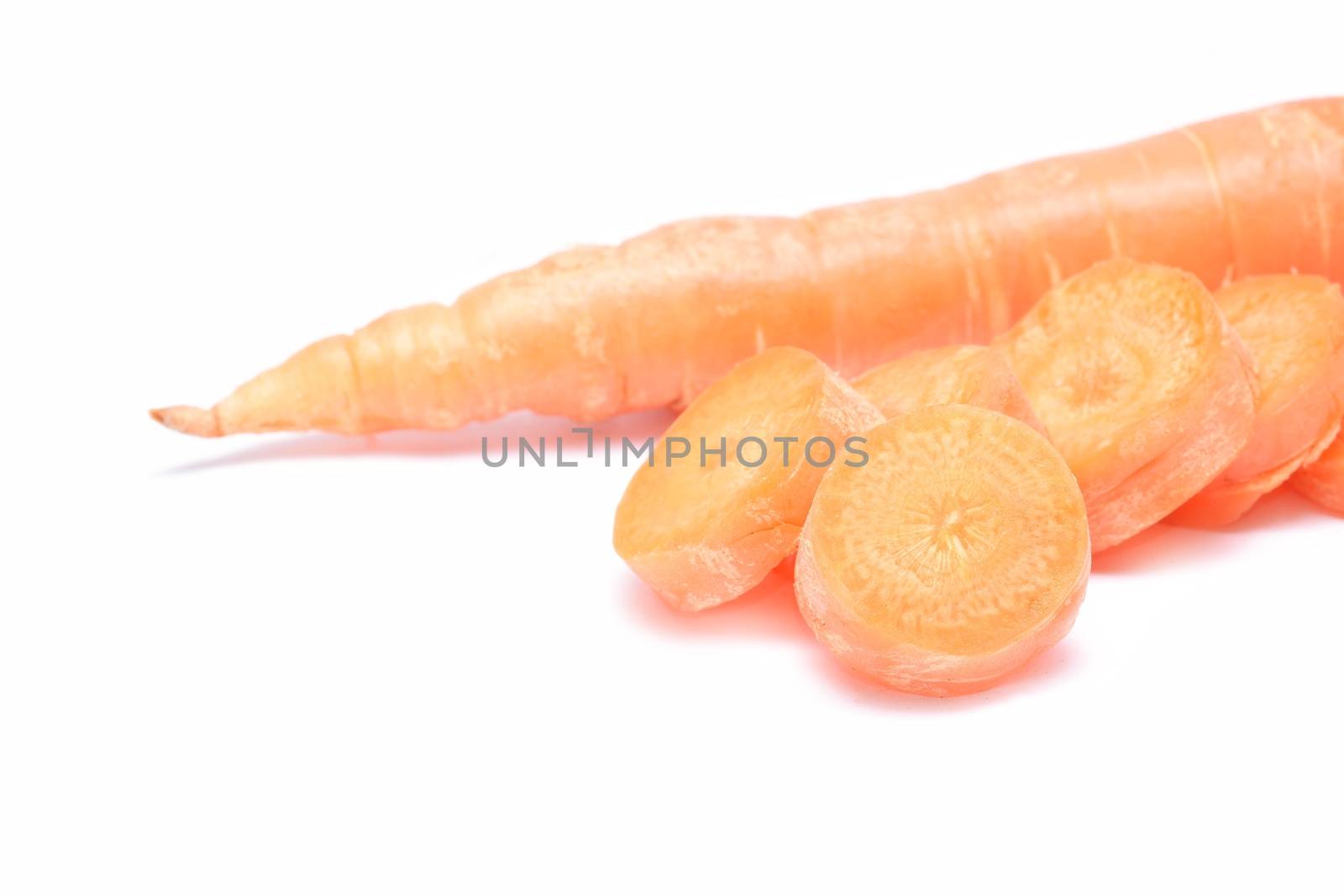 fresh carrots isolated on white background by comet