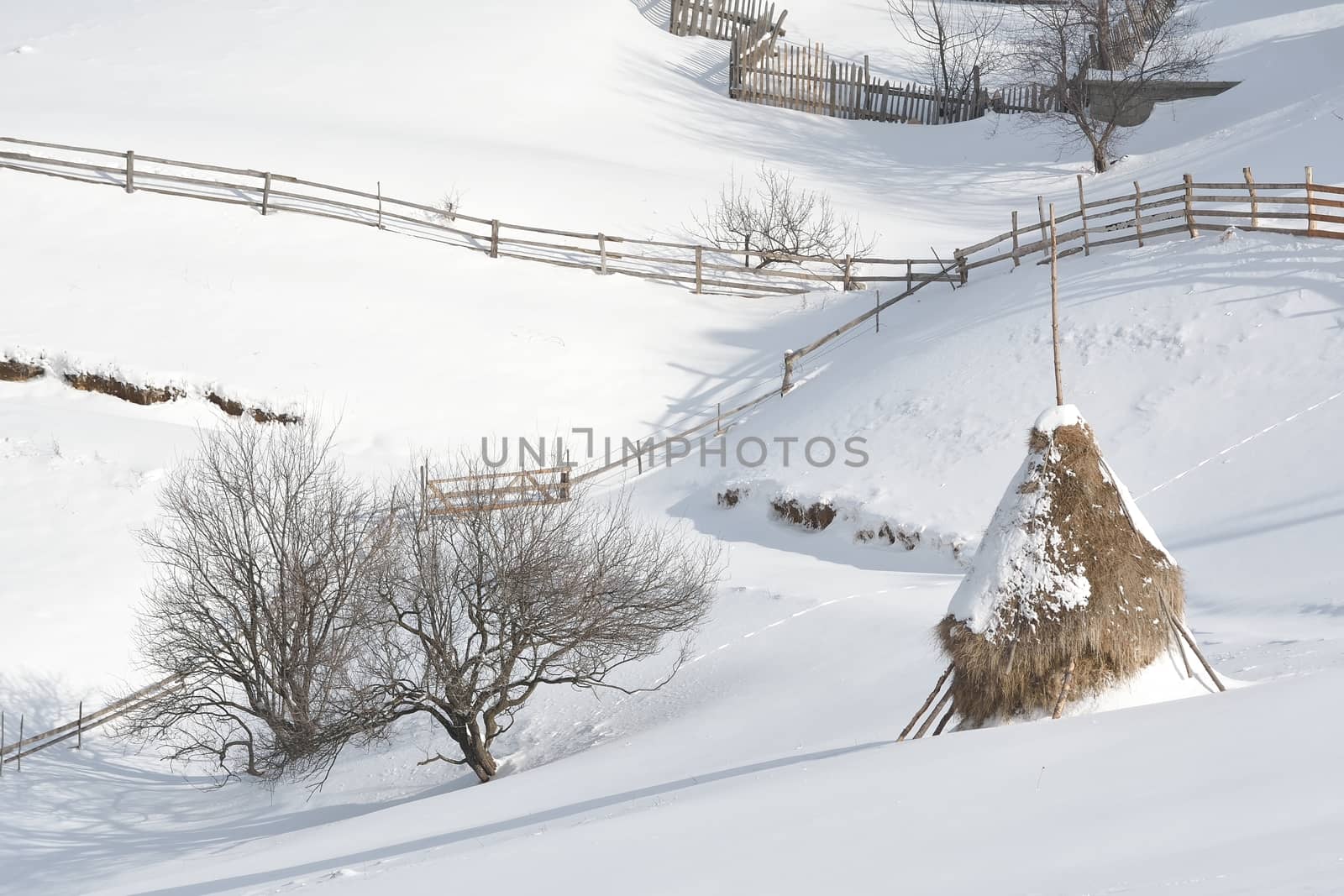 Haystack in winter mountains.