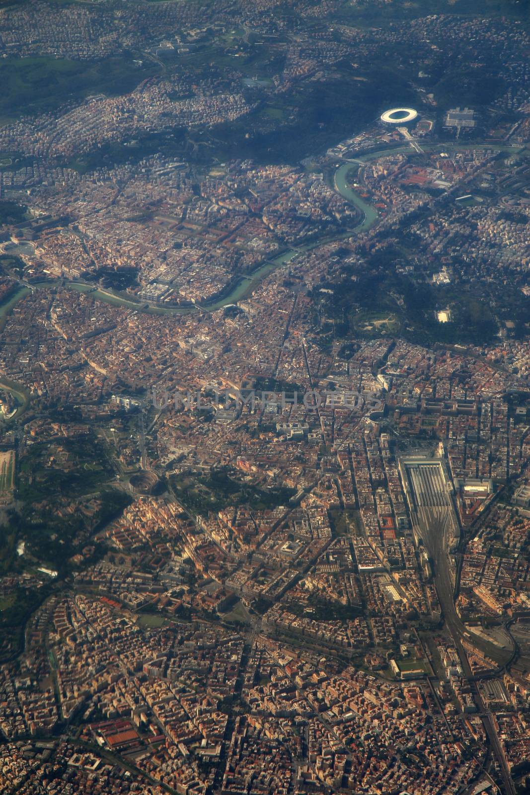 Aerial view of Rome, Italy from airplane window  by vladacanon
