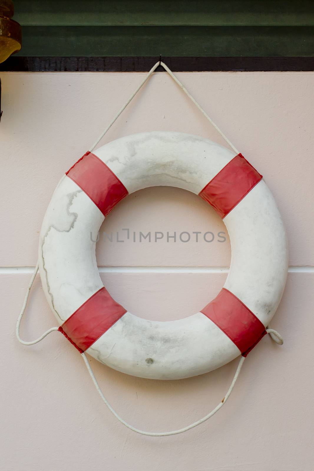 life vest on white wall.