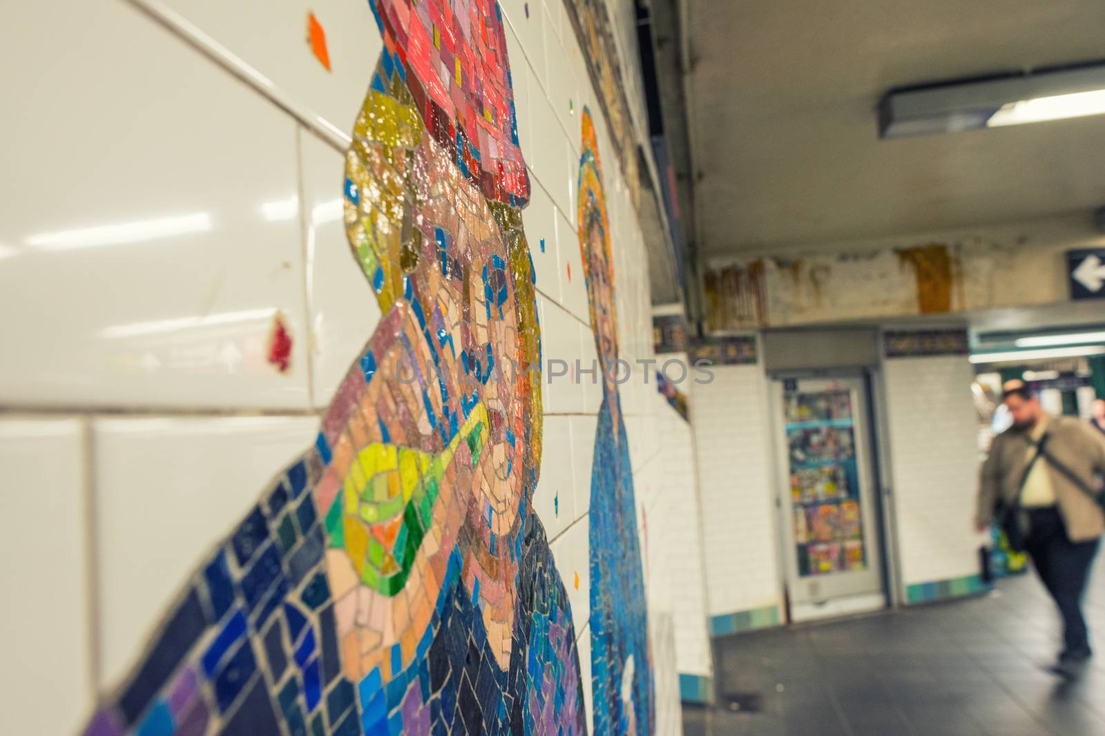 NEW YORK - MAY 23, 2013: People walks in New York subway station. The NYC Subway is one of the oldest and most extensive public transportation systems in the world, with 468 stations.