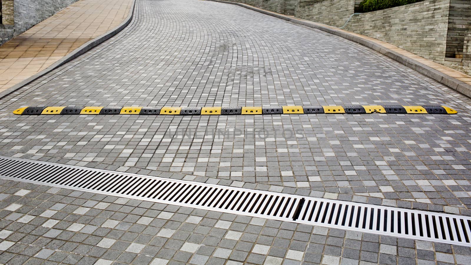 Traffic safety speed bump on an asphalt road