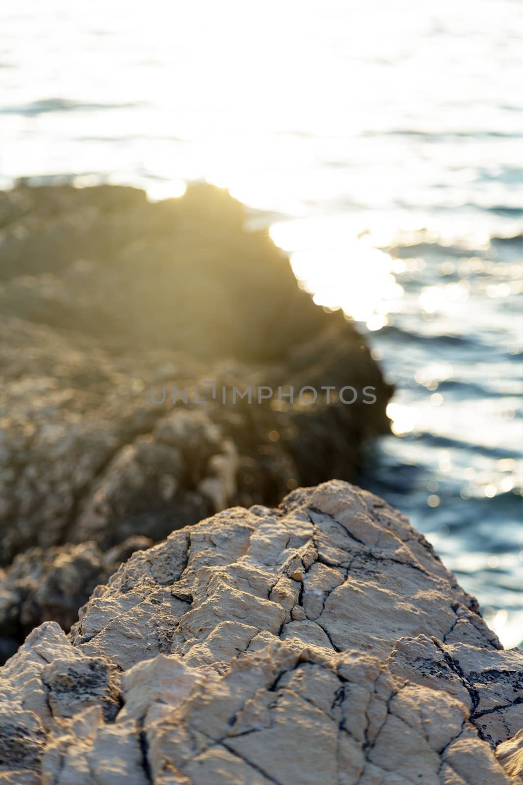 Beach with rocks and clean water closeup