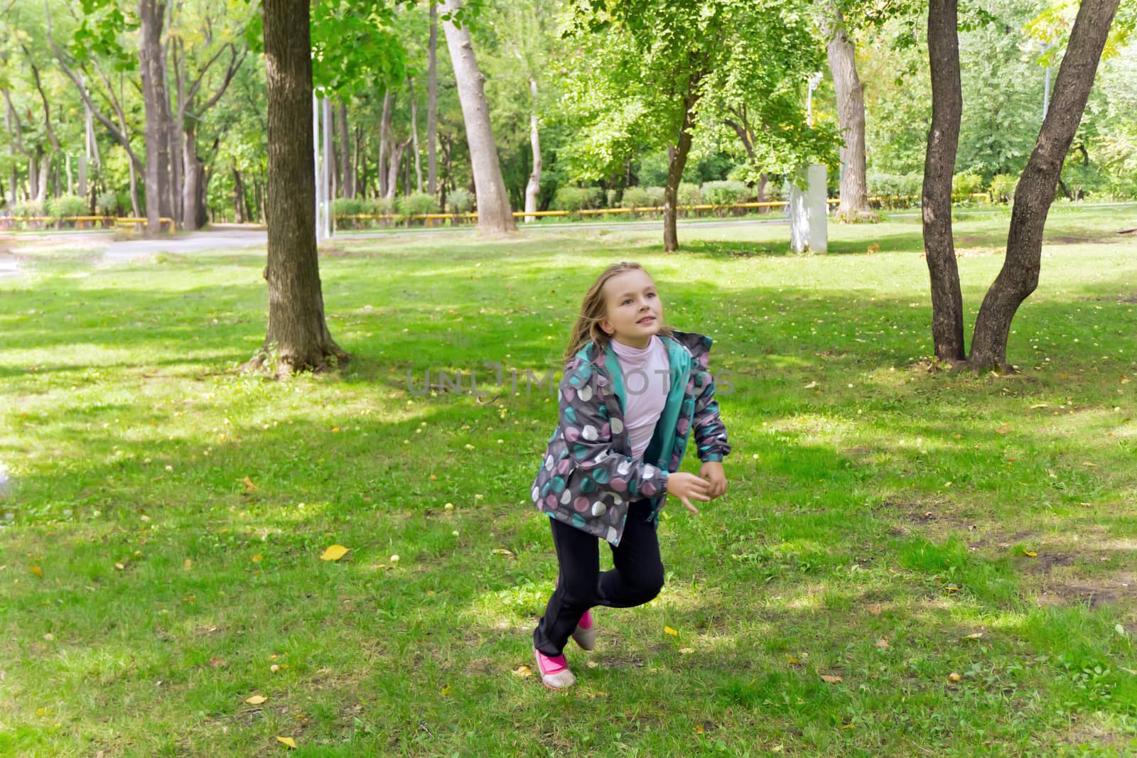 Photo of cute running girl in summer