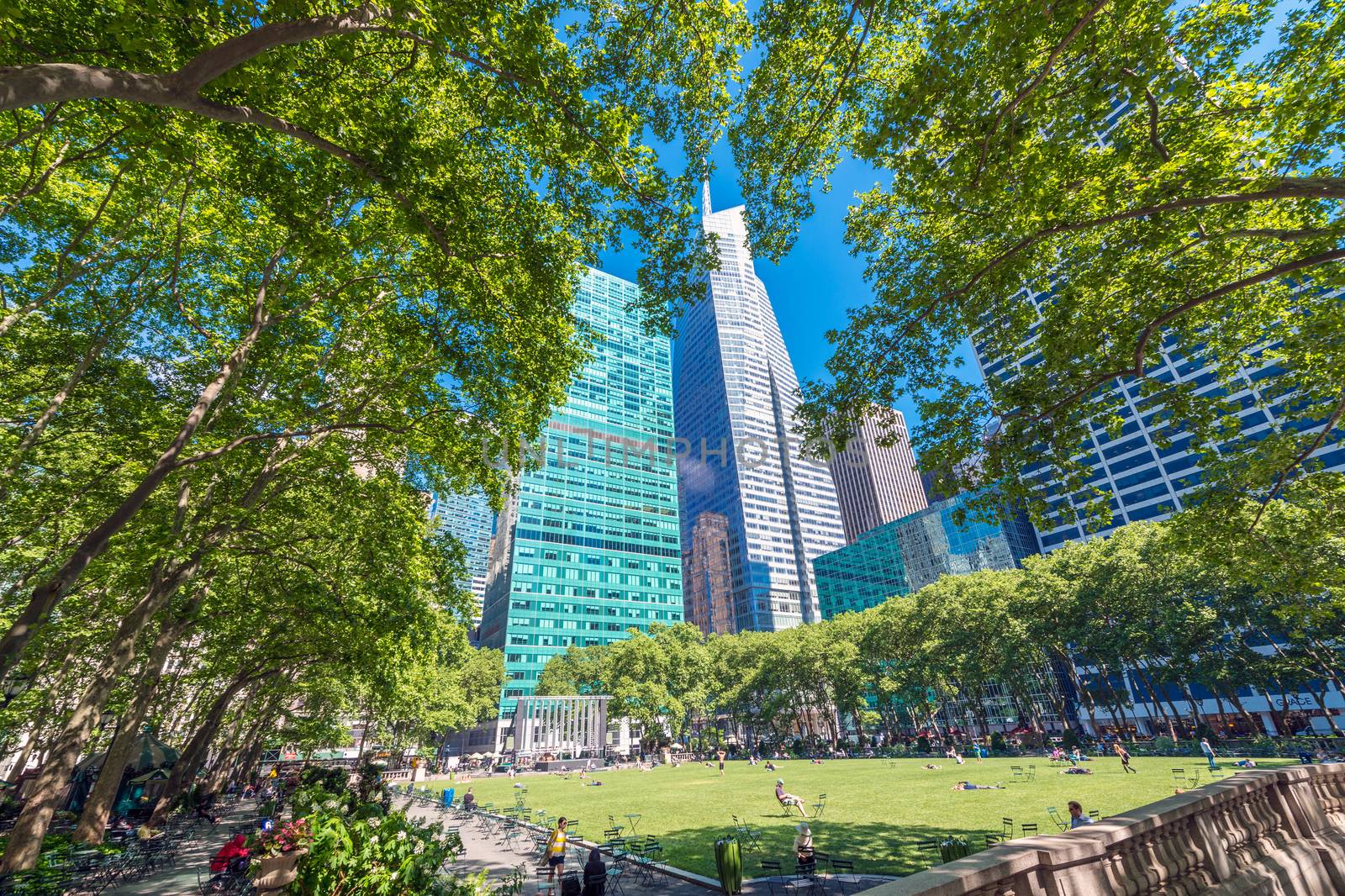 NEW YORK CITY - MAY 24, 2013: Tourists in Bryant Park. New York is visited by more than 50 million people every year.