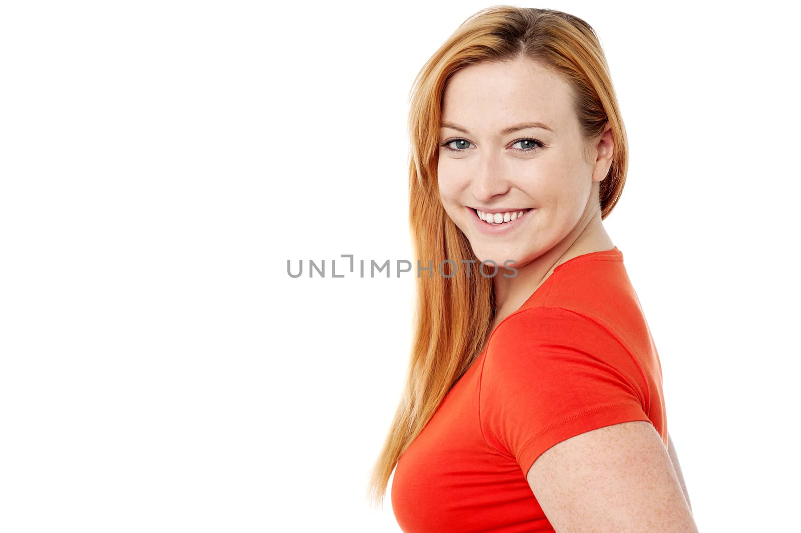 Smiling woman looking at camera by stockyimages