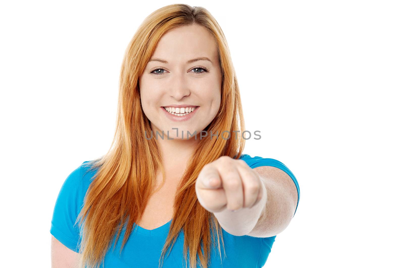 Cheerful woman pointing her finger at camera