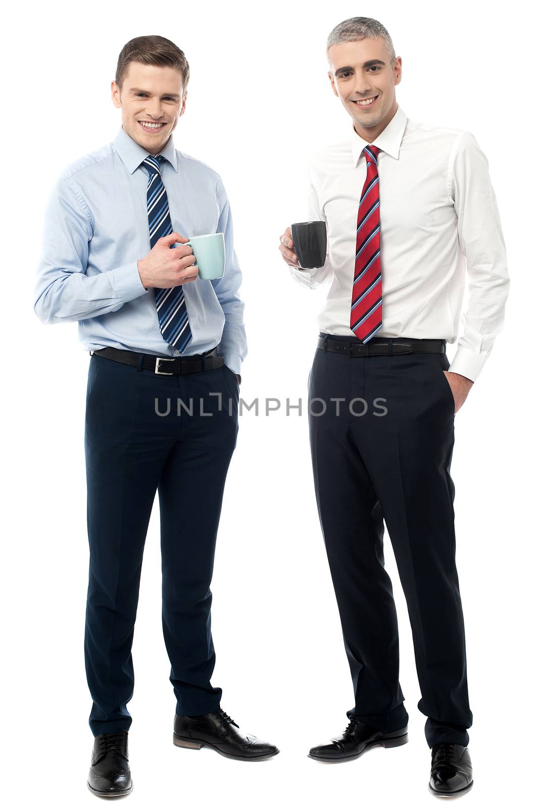 Business executives posing with coffee cup