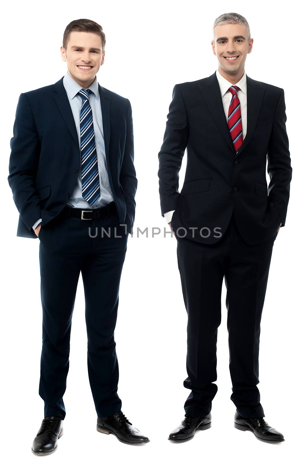 Full length of businessmen posing together