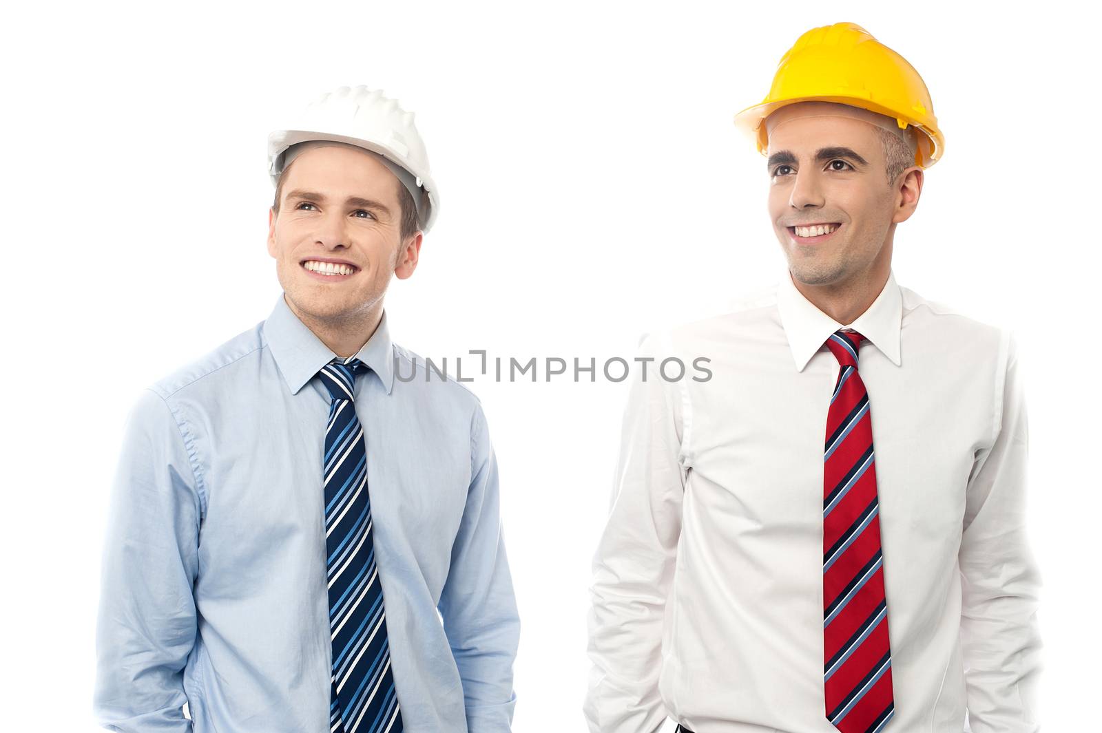Smiling male engineers looking at copy space